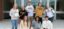 A picture of Dordt students posing with branded apparel