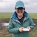 Chloe Hansum holding Vernal pool fairy shrimp, an endangered freshwater shrimp species. Photo taken under Fish and Wildlife Service Permit TE799570-6.