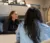 An MPA student talks with people in her office