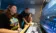 Students and faculty member work on video production