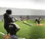 Softball players practice in the dome.