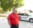 Aaron Van Beek stands in front of the Midwest Honor Flight vehicle.
