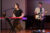 Two Dordt students singing and playing instruments