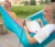 Two Dordt students laying in a hammock laughing