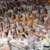 A picture of the Dordt student section at an athletic event cheering for their team