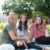 Three Dordt students sitting outside having a conversation