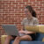 A Dordt student on her laptop studying