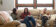 Dordt students sitting on a couch with their laptops
