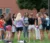 Dordt students outside standing in a circle praying
