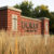 Brick sign structure at dawn displaying "Dordt University"