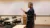 A female professor giving a lecture