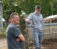 A professor and a student next to a fence at Dordts Agriculture facility