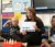 A masters in education student reads a picture book to children