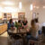 Five females sitting at a table having a conversation