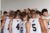 Dordt Men's Basketball in a huddle