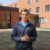 A Dordt student talking in front of a building
