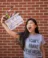 A picture of a women holding a clapperboard