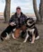 A picture of Braden Konyenbelt posing with his dogs