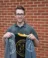 A picture of Daniel Seaman holding a week of welcome jacket