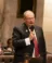 A picture of Terry Katsma speaking in front of an assembly