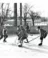 A group of men play ice hockey