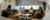 A picture of a group of roommates sitting in their apartment