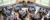 People dining in the campus center listen to President Hoekstra speak