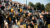 Dordt cheerleaders shake their pom-poms while the football team is on time-out