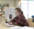 A female student works on a laptop in the library