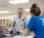 Dr. Jelsma interacts with a couple students during a lab