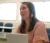 Female student sits with her laptop in class
