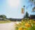 A picture of yellow flowers with a Dordt banner in the background