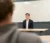 A male student sits in class like he's on the witness stand