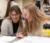 Two female students work on homework