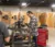 A student works at a piece of equipment in the manufacturing lab