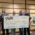 People holding up a check for the City of Sioux Center