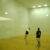 Two students play raquetball