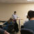 Dr. Fictore demonstrates chemical experiment to the class