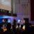 A picture of people worshiping inside of the B.J. Haan Auditorium