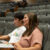 A female and male student listen to a lecture while taking notes