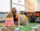 An instructor at Dordt's Thrive Center for ABA interacts with three children with a puppet