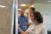 Students and professor do work on whiteboard in the library