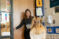 A teacher gets ready to open the door for a student