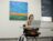 Female students works on her laptop in a classroom