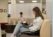 Female student works on her laptop in the library