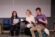 three music theatre students read from script while sitting on a couch