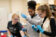 Three students work in a lab