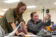two female students work on physics project in class