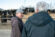 Two men talk at on a ranch