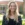 Young blonde lady smiling outside in front of building